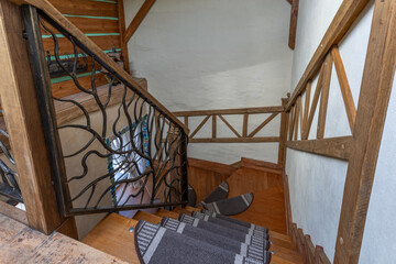 Rustic Wooden Staircase with Wrought Iron Railing Interior
