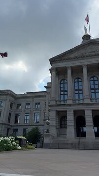 Atlanta, GA, USA, June 23, 2025: PAN SLOW - Georgia State Capitol front entrance. The building has been named a National Historic Landmark, which is listed on the National Register of Historic Places.