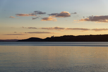 Sunset over Balaton in Hungary with clouds reflecting on the water
