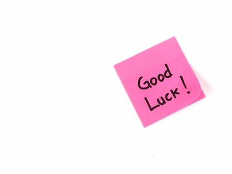 Pink sticky notes with good luck text on white background. positive vibes, motivation, and support concept - Powered by Adobe