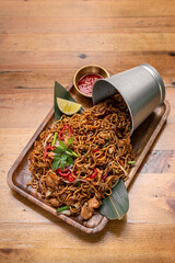 pad thai chicken stir fry noodles in modern restaurant in thailand