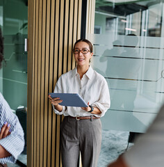 Group of young business people having a meeting or presentation and seminar standing in the office....