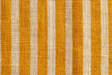 a rustic yellow and white striped linen fabric texture with a woven pattern