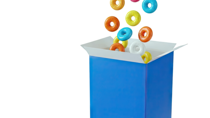 Colorful cereal rings pouring into a blue box