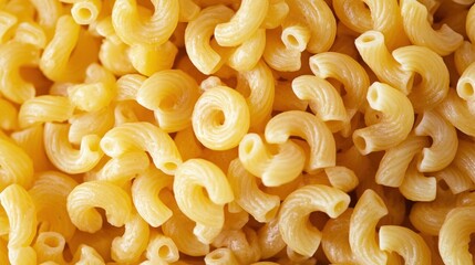 A close-up of a pile of macaroni pasta with a golden-brown hue.