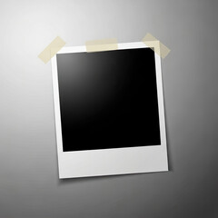 Blank polaroid photo with tape