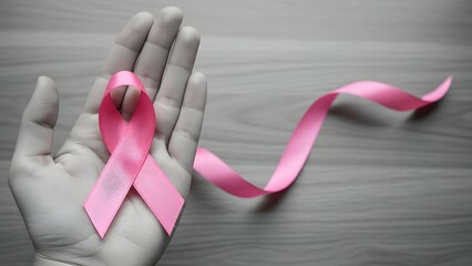 
Breast Cancer pink ribbon awareness on woman hand, bow color concept raising awareness campaign on female patient with breast tumor illness bow isolated with clipping path