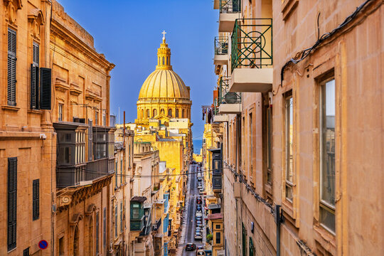 Valletta, Malta. Street that leeds down to the Grand Harbour and St Paul's Cathedral's dome.