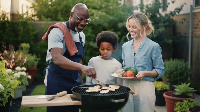 multiethnic Family enjoy barbecue in the backyard 