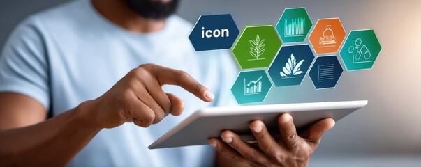 Person using tablet with floating icon hexagons representing technology, nature and data insights