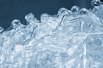Close up scene of group of preform shape of PET bottle products in the light blue scene.