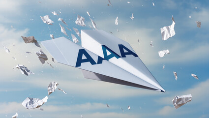 Paper airplane flying in sky with crumpled paper around showing credit and rating downgrade concept in creative way