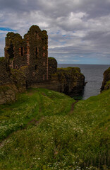 Scotland, Uk: glimpse of Castle Sinclair Girnigoe, complex of spectacular ruins on the coast of Caithness of two joined castles seat of the Clan Sinclair, Lords of Orkney and  Earls of Caithness