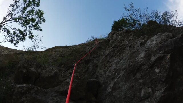 Climber Clipping Quickdraw To Protection Bolt Action Low Angle Safety Focus