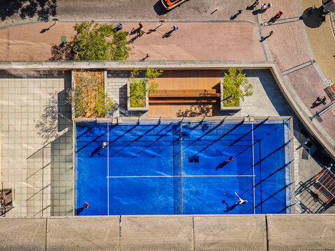 Padel court from above. Aerial view of padel tennis court from balcony of skyscraper. Padel court in Dubai Marina