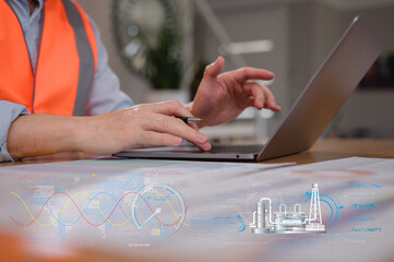 Engineer wearing safety vest typing on computer laptop working with ai technology diagram. DevOps engineer in Digital transformation technology strategy of business processes and data