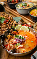 mixed seafood tom yum thai curry soup indoors ina a phuket thailand restaurant