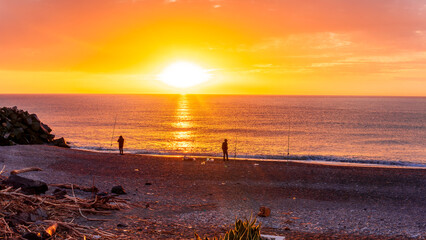 beautiful sea sunset or sunrise landscape of  coastal fishing for sea trout by the Mediterranean Sea shore at sunset