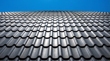 Modern roof tiles pattern under daylight, representing home construction, building material, property protection, architecture design and residential exterior concept.