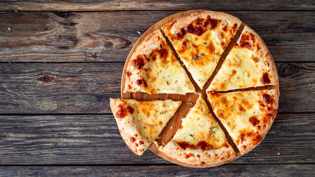 Pizza Bianca white pizza with oregano on wooden table. Top view