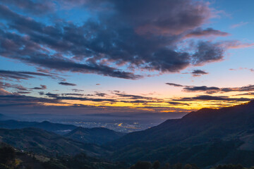 Beautiful panorama landscape skyline of Doi Sakad mountain valley with city light at sunset sky in Pua Nan Thailand Winter travel season concept