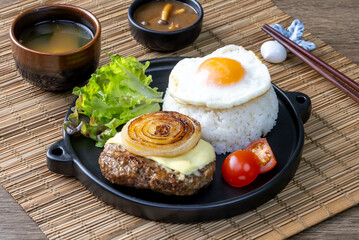 Loco Moco, a traditional Hawaiian dish of teriyaki flavored ground beef patty and a fried egg on a bed of rice, smothered in gravy