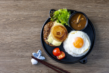 Loco Moco, a traditional Hawaiian dish of teriyaki flavored ground beef patty and a fried egg on a bed of rice, smothered in gravy