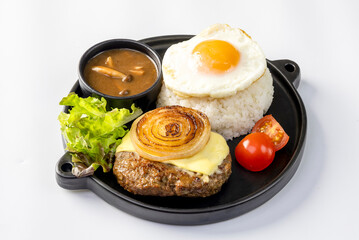 Loco Moco, a traditional Hawaiian dish of teriyaki flavored ground beef patty and a fried egg on a bed of rice, smothered in gravy