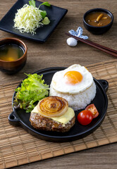 Loco Moco, a traditional Hawaiian dish of teriyaki flavored ground beef patty and a fried egg on a bed of rice, smothered in gravy