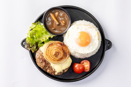 Loco Moco, a traditional Hawaiian dish of teriyaki flavored ground beef patty and a fried egg on a bed of rice, smothered in gravy