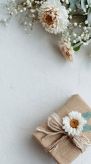 Gift box placed in lower third of vertical frame, airy background, marketing mockup style.