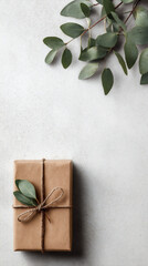 Gift box placed in lower third of vertical frame, airy background, marketing mockup style.