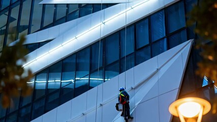 Technicians installing LED lights on a modern building facade enhancing architectural features with bright energyefficient illumination.