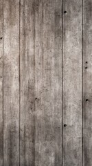 Obraz premium Weathered vertical wooden planks show grain and knots with a muted gray-brown texture and aged patina