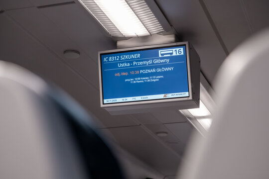 Poznan, Poland - November 30, 2025: PKP INTERCITY digital display in train, showing Ustka to Przemysl Glowny route, aiding efficient Polish rail travel