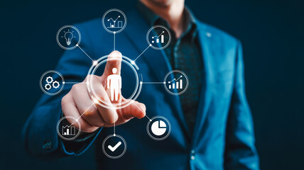 Close-up of a man in a blue suit interacting with a digital human resource management system business