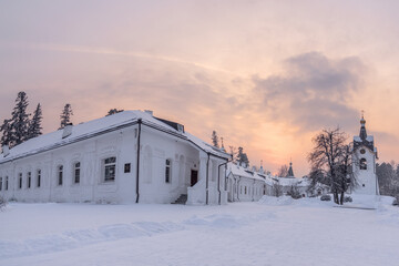 Fototapeta premium Holy Dormition Monastery in Krasnoyarsk, Orthodox Christian Church and faith. Russia, winter. Beautiful sunset on the background of the monastery. High quality photo