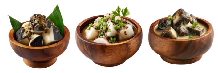 Steamed taro and rice cakes with coconut sauce, scallions, and peanuts in wooden bowl, isolated on white background