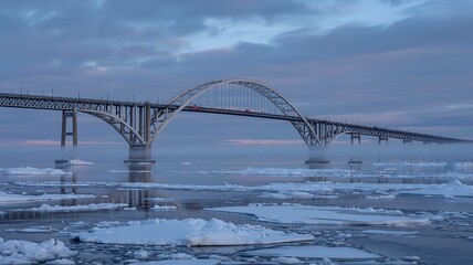 Obraz premium Winter river crossing massive bridge mist ice cold dawn photo