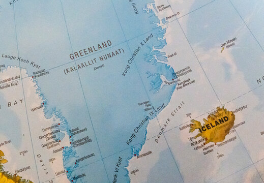 Warsaw, Poland - Jan 11, 2026: A close-up view of a detailed world map highlighting Greenland and Iceland. Geographic features, boundaries, and major locations are visible.