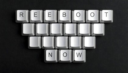 Individual silver keyboard keys spelling out 'REBOOT NOW' on a dark background, symbolizing a system restart or fresh start.