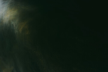 Abstract dark matter, black background. Moving flow of smoke and paints