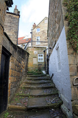 Narrow alleyway with steps, Robin Hood's Bay, North Yorkshire England
