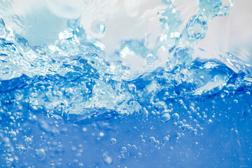 Closeup Transparent blue clear water surface texture with ripples. Abstract​ of​ surface​ blue​ splashes and bubbles​ water waves  reflected​ with​ sunlight​