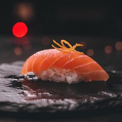 Close-up of a delicious salmon nigiri sushi with orange zest garnish on a dark textured surface with bokeh lights in background
