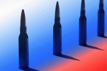 Conceptual image of rifle bullets against the background of the russian flag, symbolizing war, aggression, authoritarian rule and violent totalitarian regimes that threaten global security.