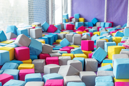 Bright foam cube pit in children&rsquo;s indoor playground