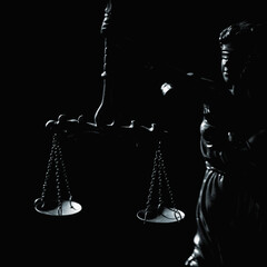 Statue of Lady Justice with scales in dark dramatic lighting symbolizing law, fairness, balance, judgement, authority, and legal responsibility.