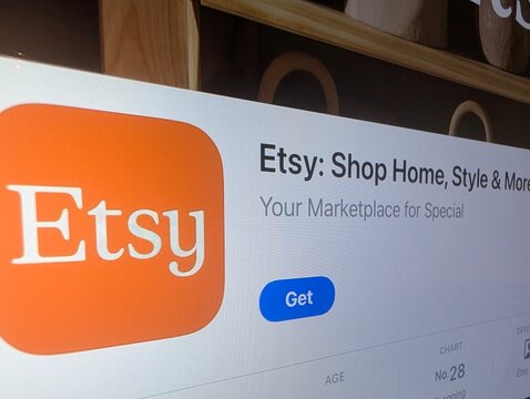 Etsy app store page on smartphone screen for e-commerce and handmade marketplace concept