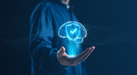 A glowing digital brain with a shield symbol appears above an open hand, artificial intelligence security, data protection, and cybersecurity concepts for modern technology and business innovation.